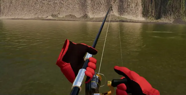 Two gloved hands on the rod and reel with the line in the river